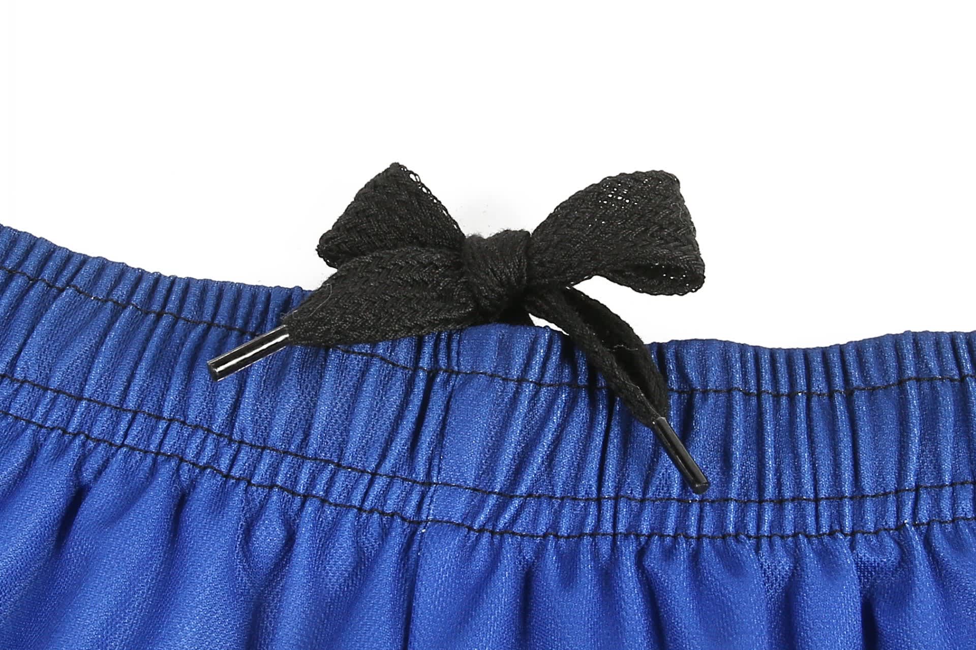 Blue soccer uniform shorts with a black drawstring tie at the waist, featuring a woven texture.