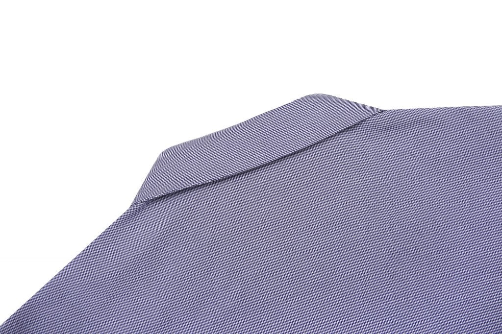 A close-up of a custom school girl blouse in blue and white stripes, featuring a collar and subtle texture.