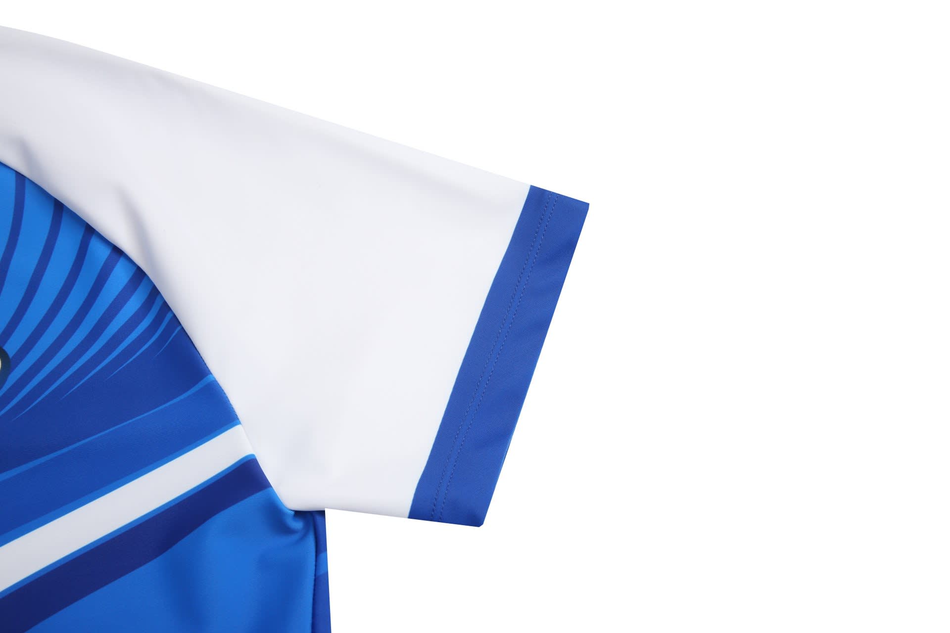 A blue and white athletics uniform tight with a logo on the sleeve, featuring dynamic design elements.