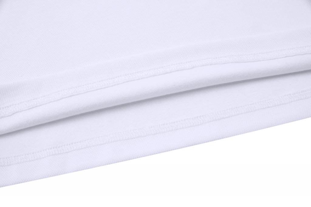 A close-up of a white cotton polo shirt, showcasing the fabric texture and seam details.