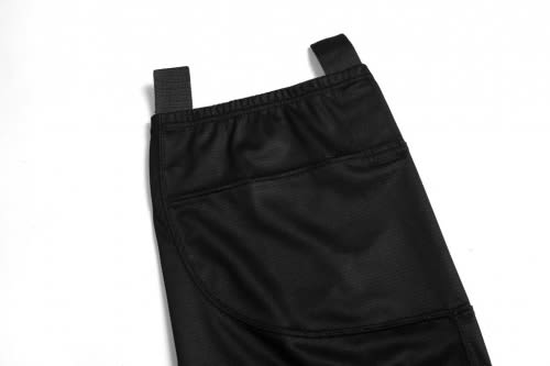 A black ice hockey racing uniform featuring adjustable straps and textured fabric. It includes pockets for convenience.