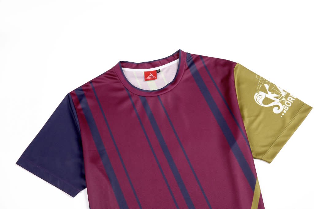 A maroon and olive green skateboard-themed T-shirt with a logo, featuring horizontal stripes and a crew neck design.