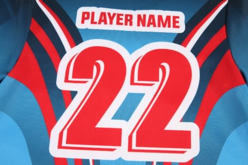 A blue sports jersey featuring red and black design elements, with a prominent number 22 and a logo.