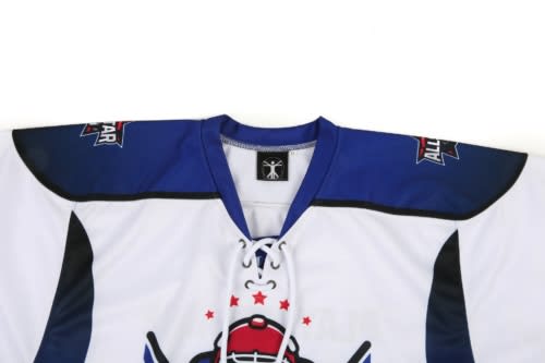 A blue and white ice hockey jersey with a lace-up collar and a logo on the front.