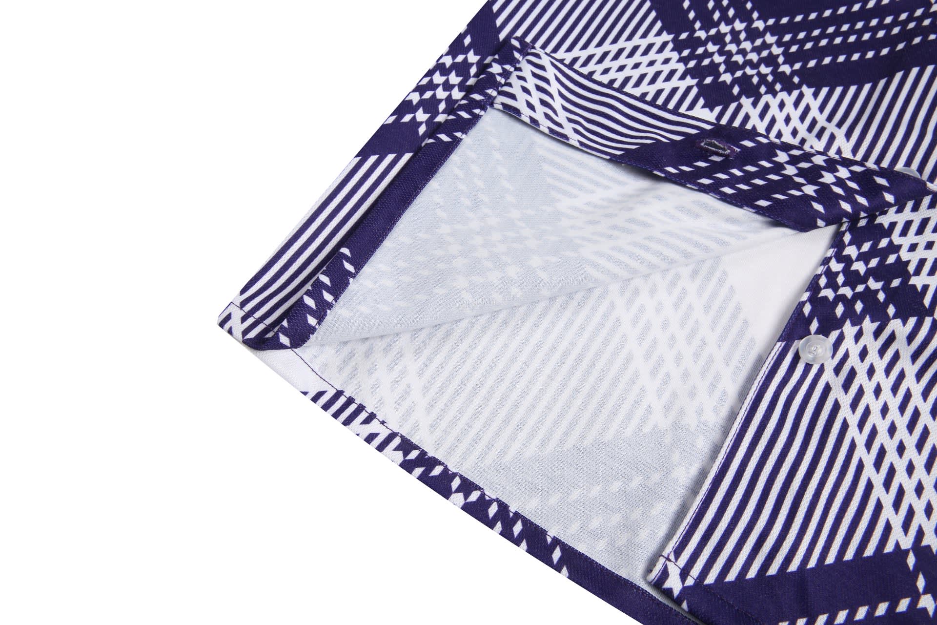 A flannel women's shirt featuring a purple and white geometric pattern with button details.