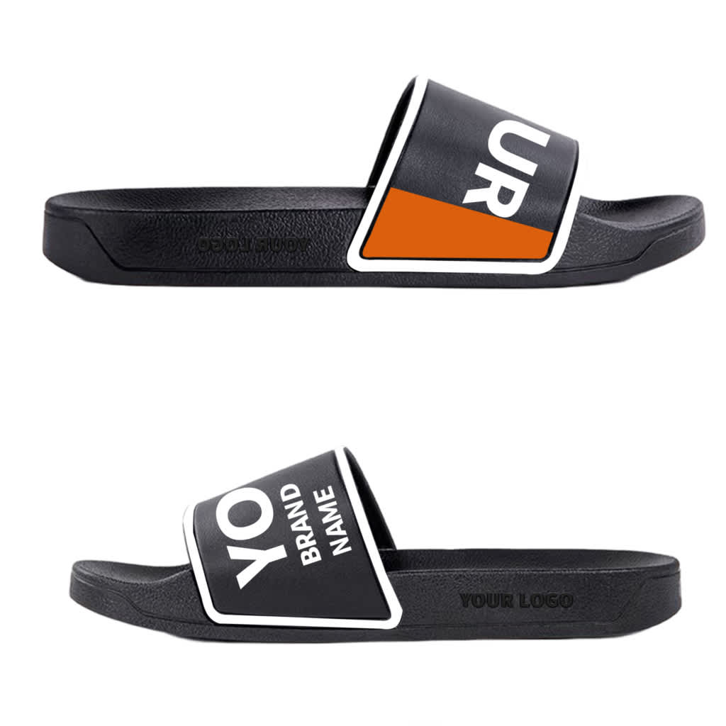 Black slippers featuring bold white and orange graphics, including a logo on the strap.