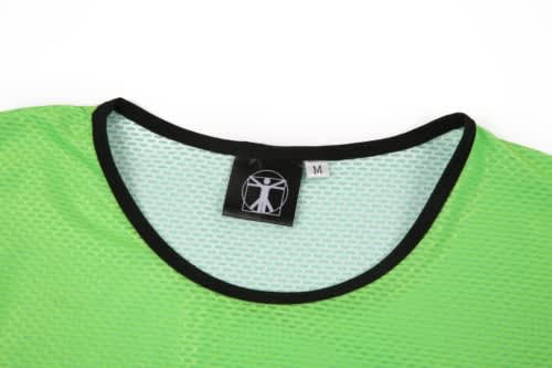 A green mesh staff bib with a black neckline and a tag indicating size M. It features a logo on the tag.