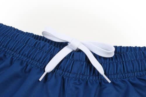 A blue sports uniform featuring a waistband with white drawstrings. Includes a logo on the waistband.