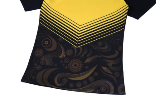 A black and yellow hoodie featuring a striped design and intricate patterns on the fabric. It has a logo.
