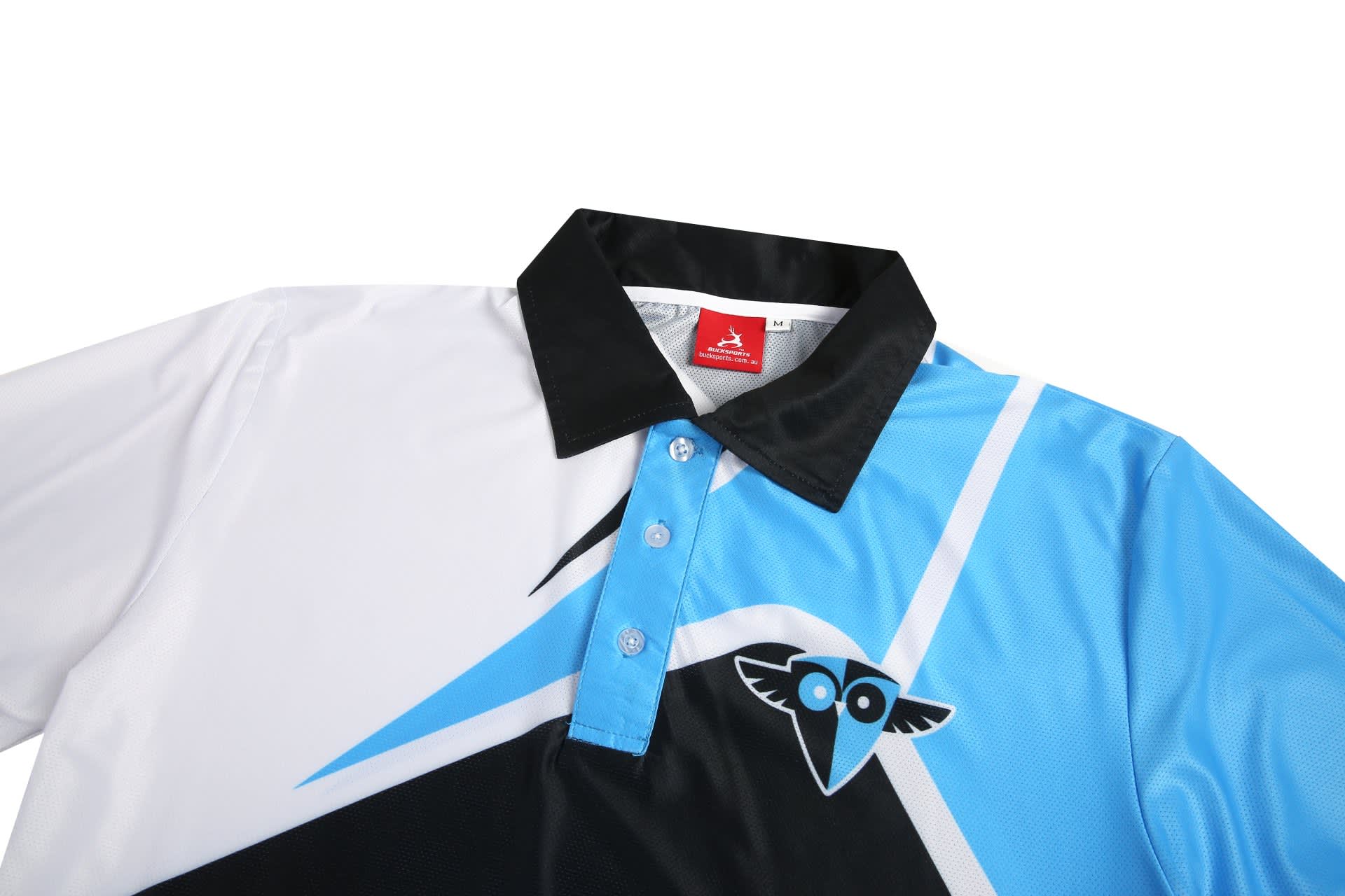A black, white, and light blue polo shirt featuring a logo and a collar with buttons.