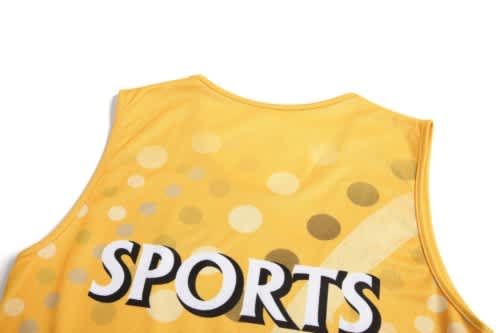 A yellow sports jersey featuring a dotted design and a branding logo on the back.