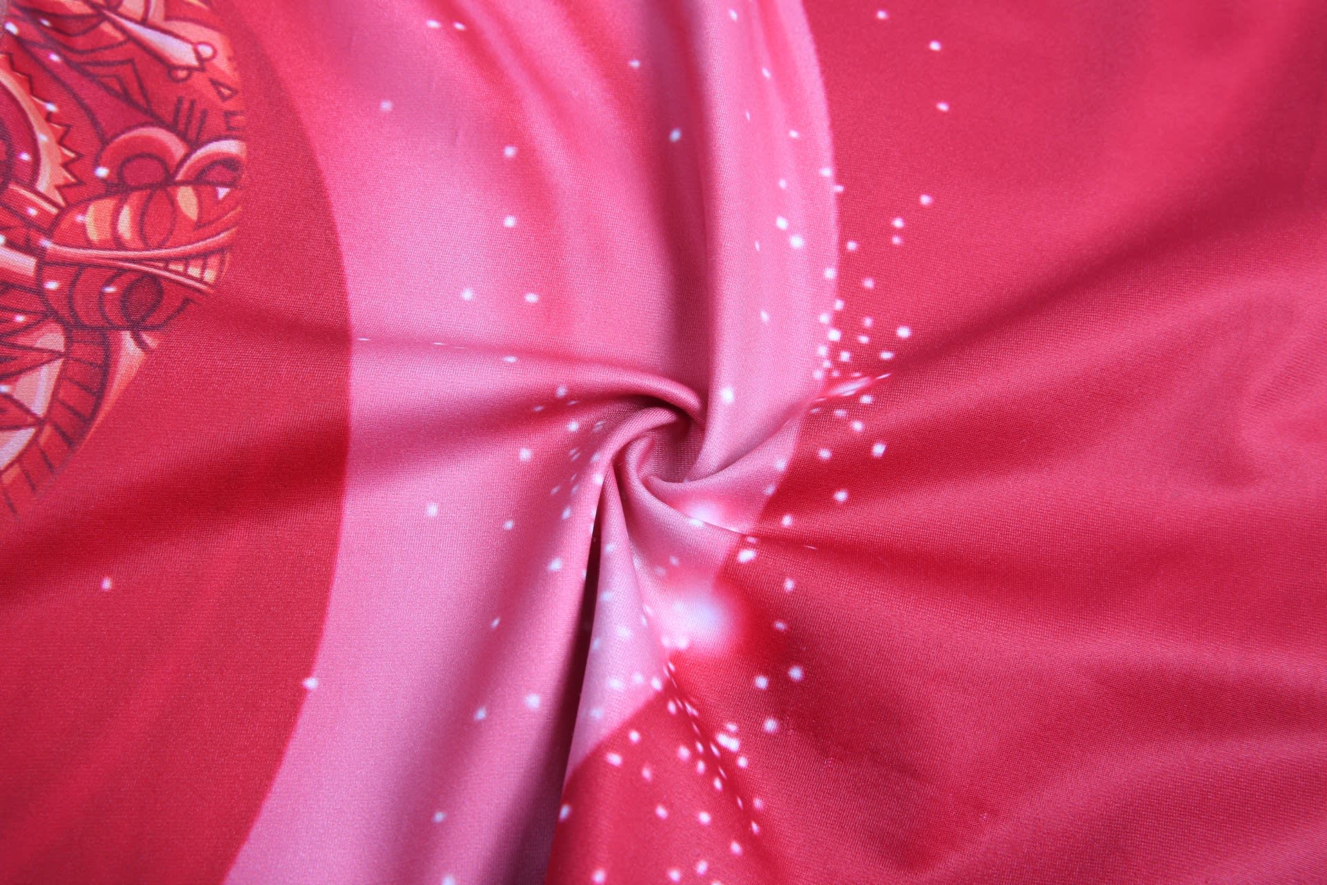 A swirl of pink fabric featuring a vibrant design with sparkles, suitable for swimwear. Includes a logo.