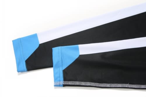 A sports uniform featuring black fabric with blue and white accents on the sleeves, including a logo detail.