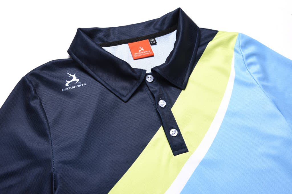 A polo shirt in navy, light blue and green with a logo on the left side and three buttons down the front.