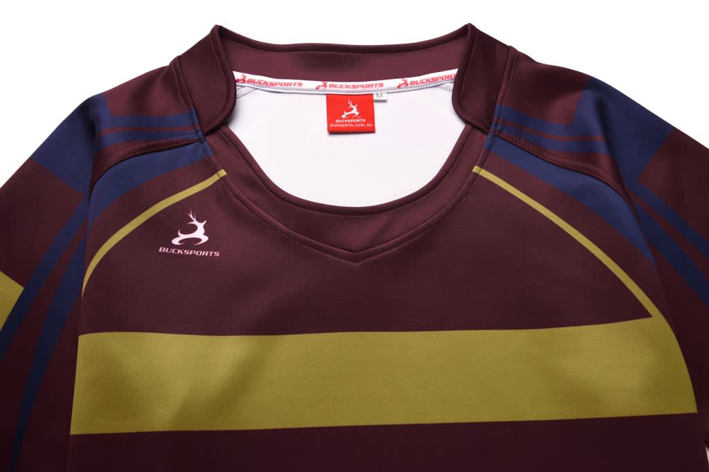 A rugby tee in maroon, green, and navy with a logo and a collar.