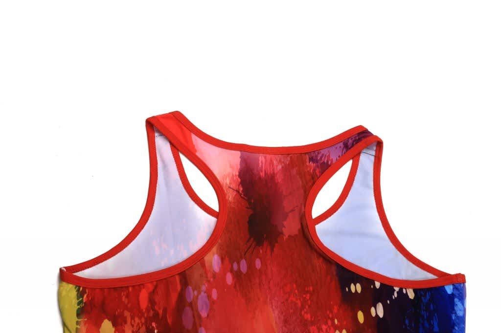 A vibrant red singlet with a colourful splash design and a racerback cut, featuring a logo on the back.