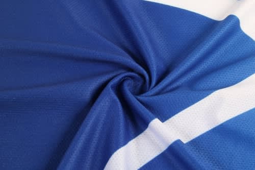 A basketball jersey detailed with blue fabric and white stripes, featuring a logo.