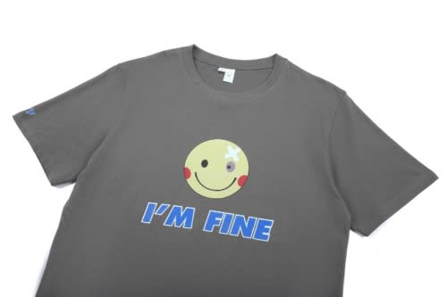 A grey cotton t-shirt featuring a smiley face graphic and the text "I'M FINE," with a logo on one sleeve.