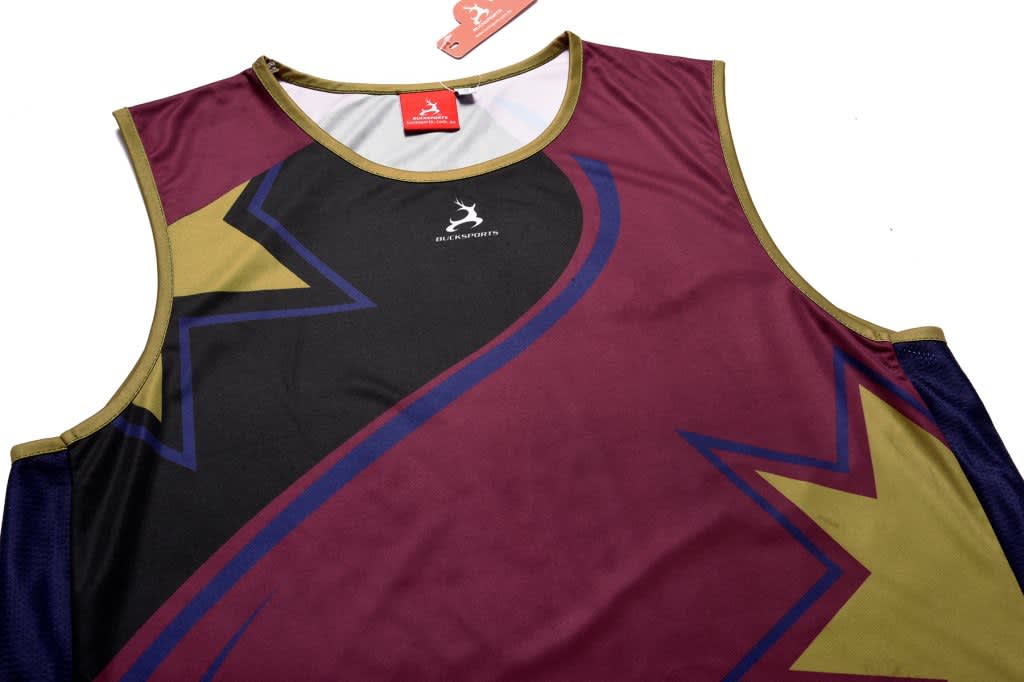 A maroon and navy singlet featuring a bold design with star patterns and a logo.