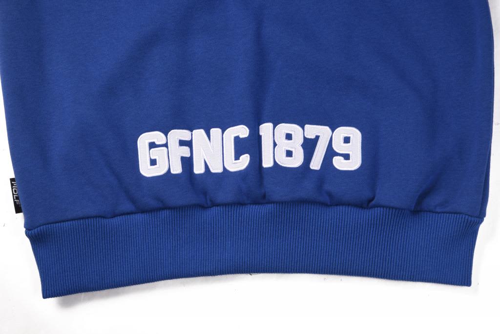 A blue polar fleece hoodie featuring a white logo and text at the bottom. It has a snug fit at the waist.