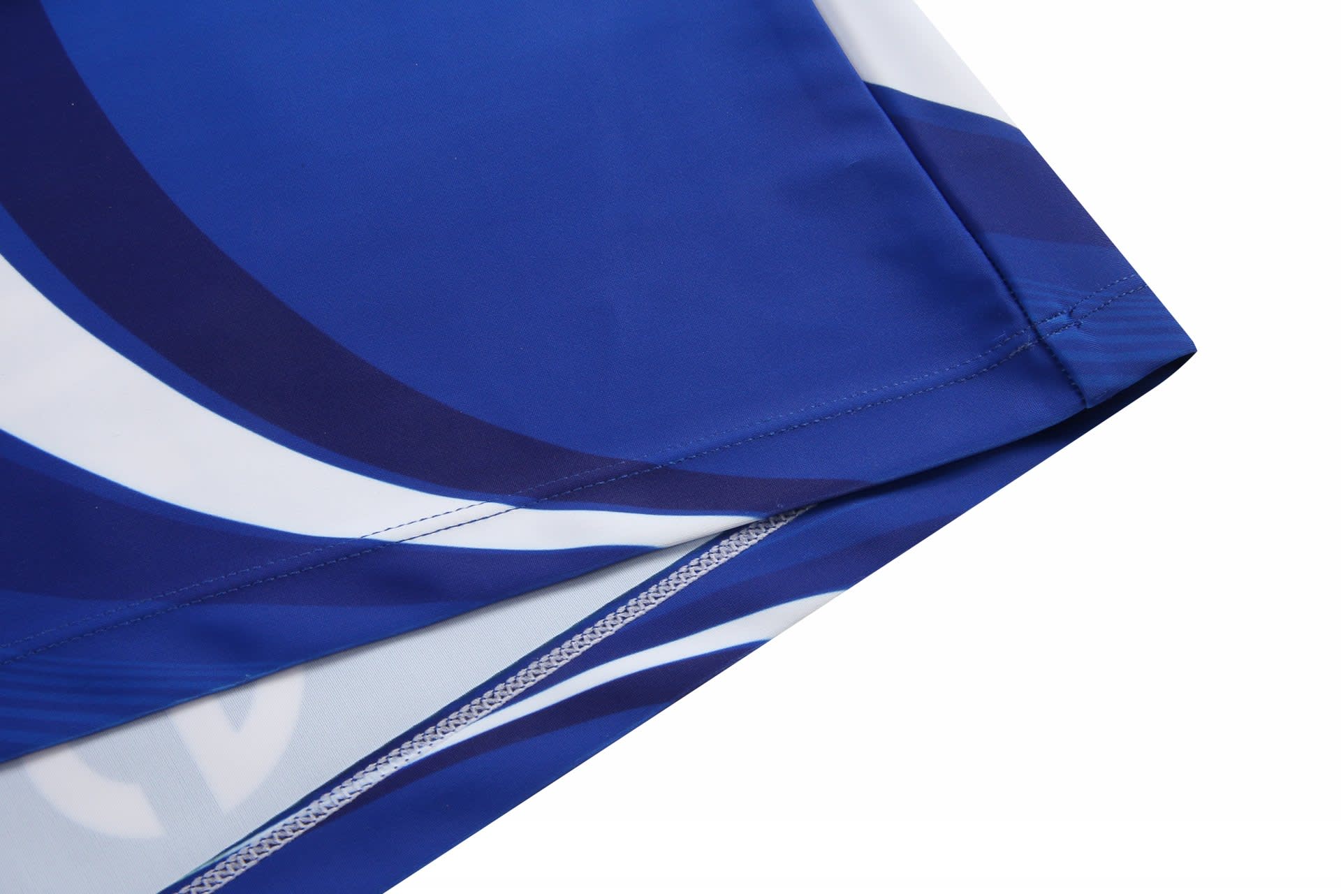 A blue and white athletics uniform tight with a smooth finish and an embroidered logo.