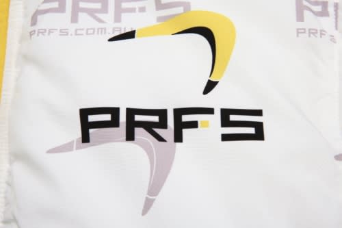 A promotional item featuring a design with a logo in black and yellow on a white background.