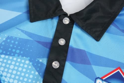 A blue and black sports uniform featuring a collared design and a buttoned placket, with a logo present.