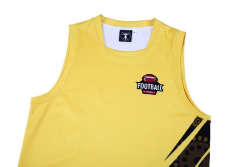 A yellow sports singlet features a logo and unique design elements along the side. It is part of a sports uniform.