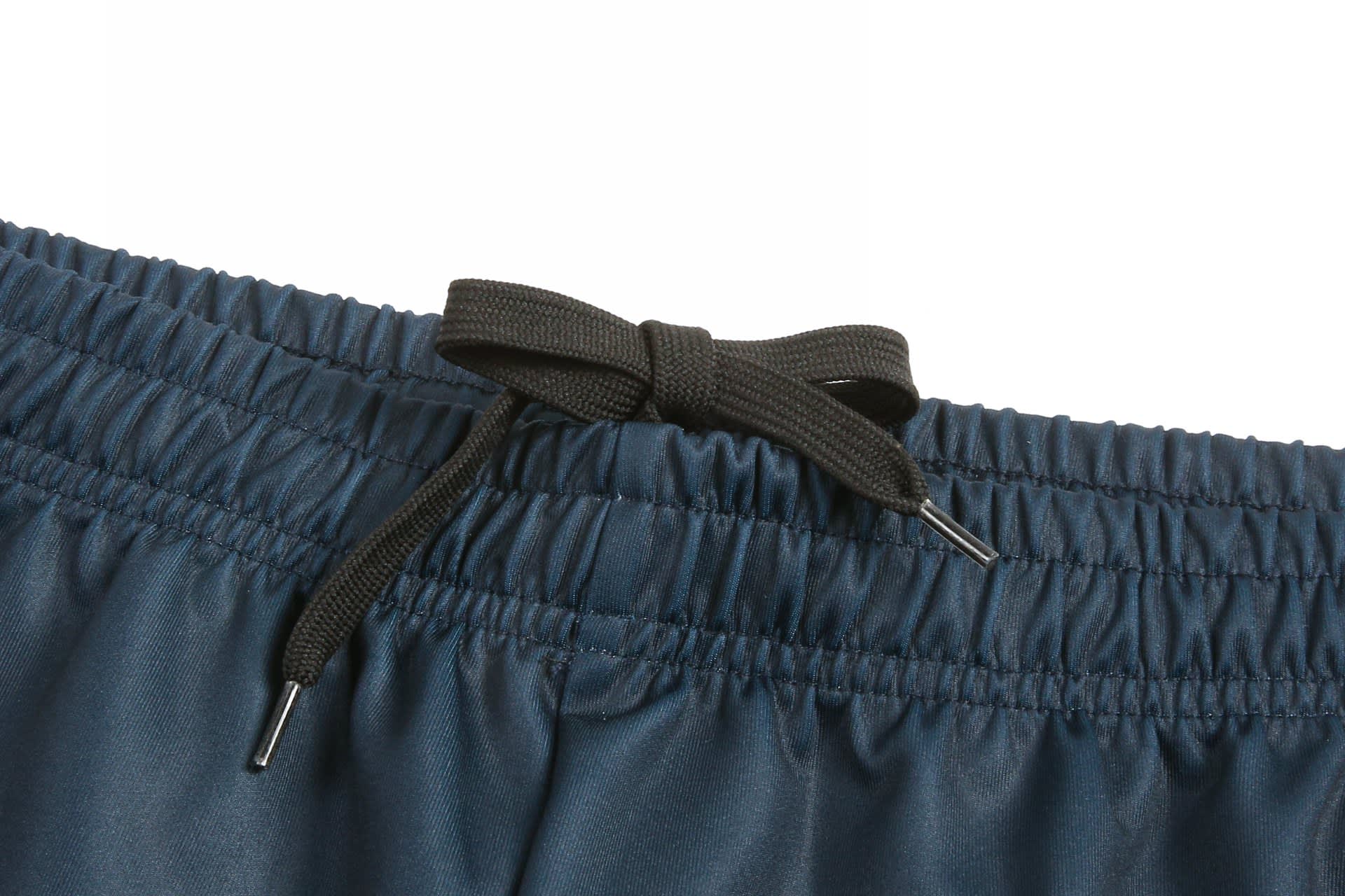 Navy cricket uniform pants featuring an elastic waistband with a black drawstring for adjustable fit.