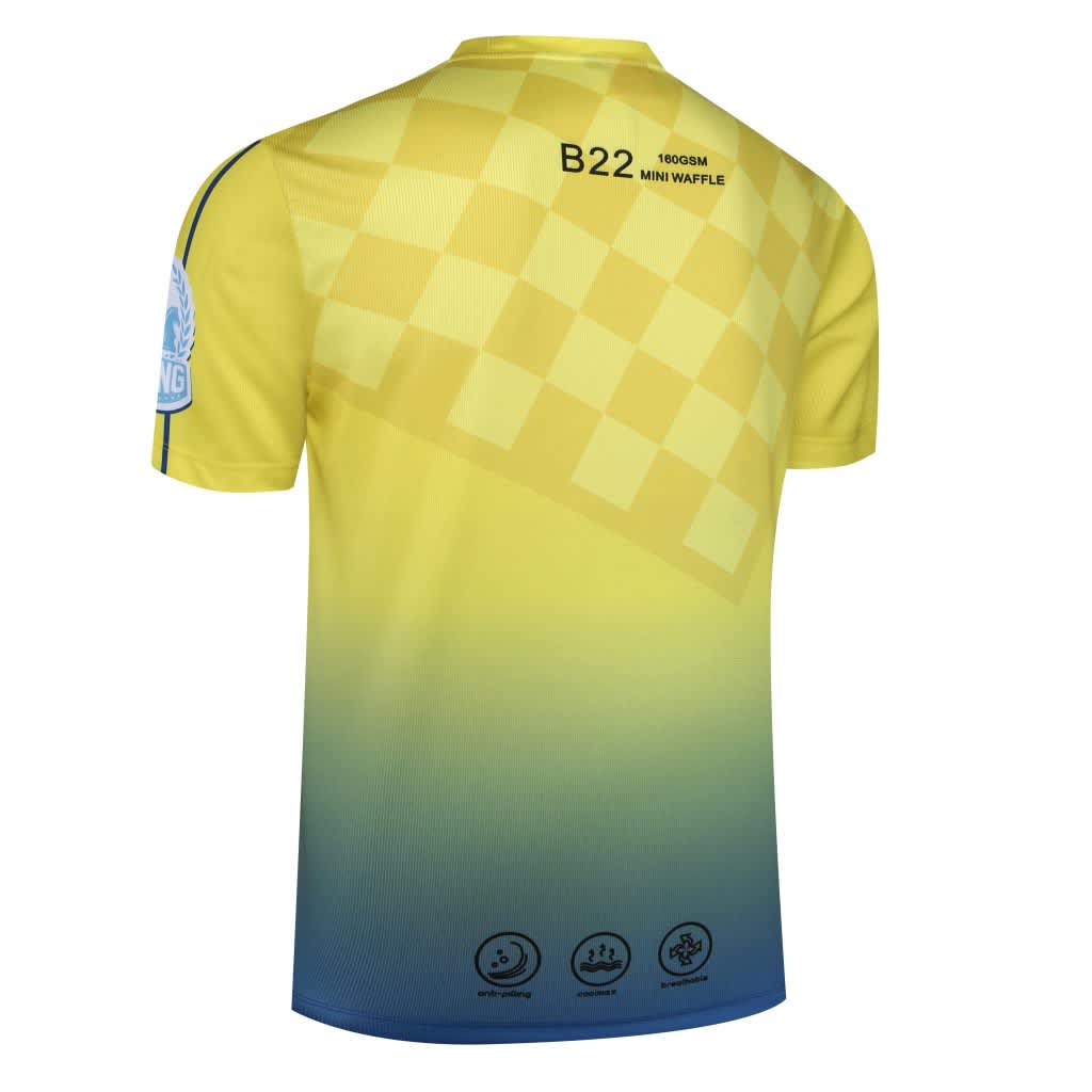 A yellow and blue chess-themed shirt featuring a checkered pattern and a logo on the sleeve.