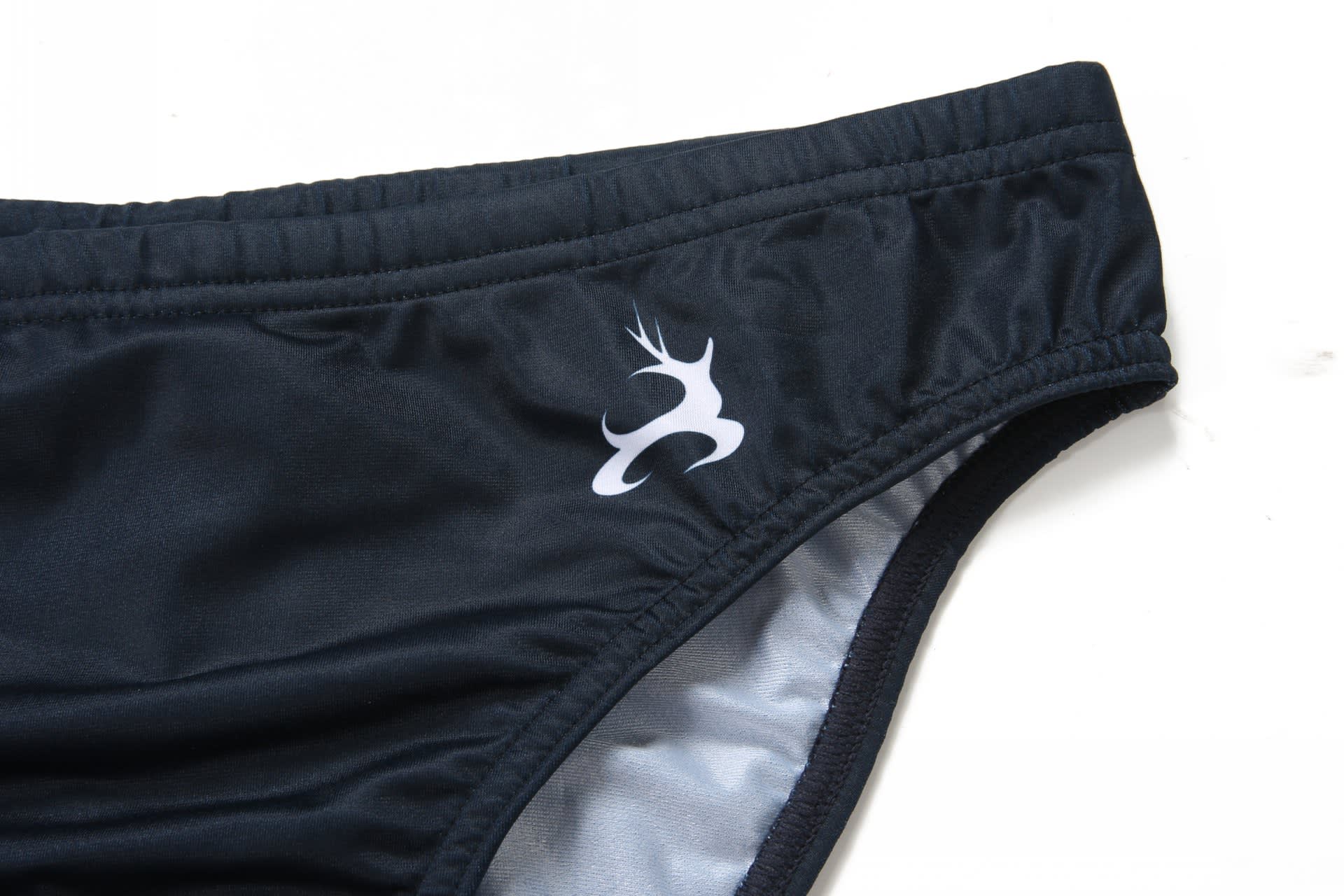 A black swimming brief featuring an anti-chlorine design and a logo on the side.