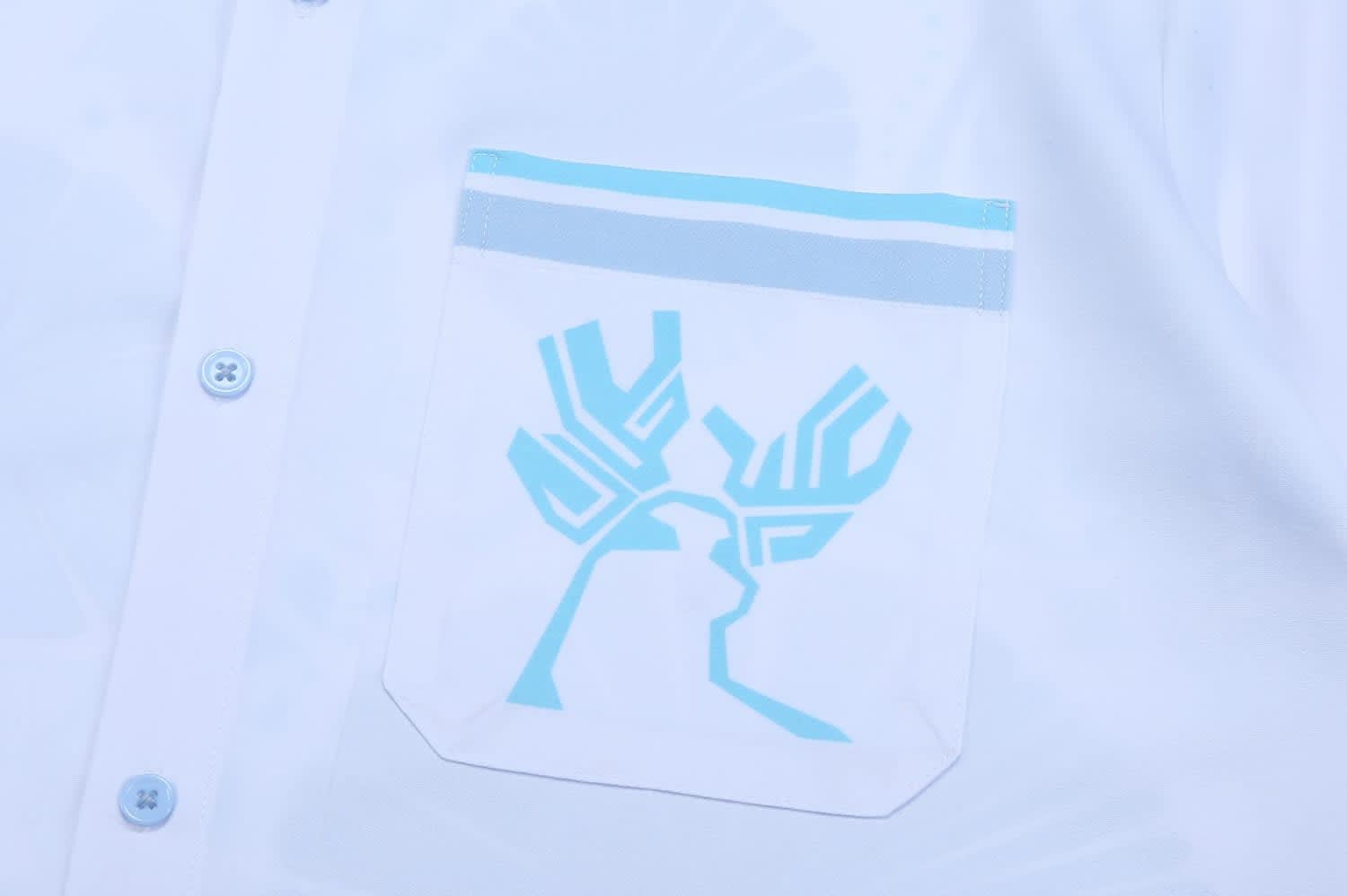 A white school wear shirt featuring a blue pocket design with a logo.
