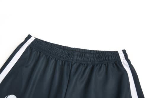 Black sports shorts with white stripes along the sides and an elastic waistband. Features a logo.