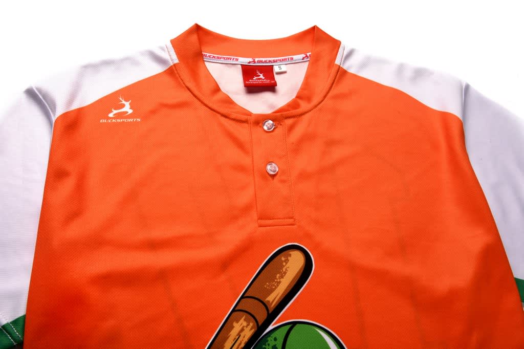 A baseball club shirt in orange and white, featuring a two-button front and a logo.