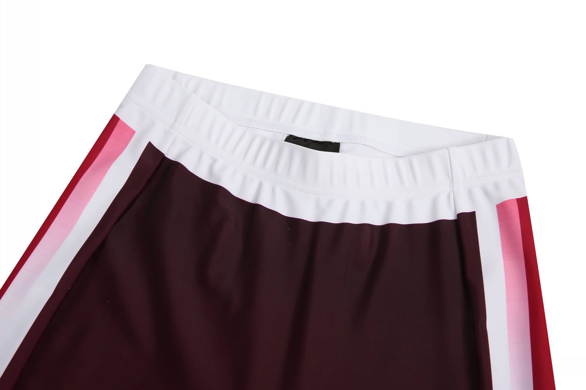 Tight track pants featuring a maroon body with white and pink stripes along the waistband. Includes a logo.