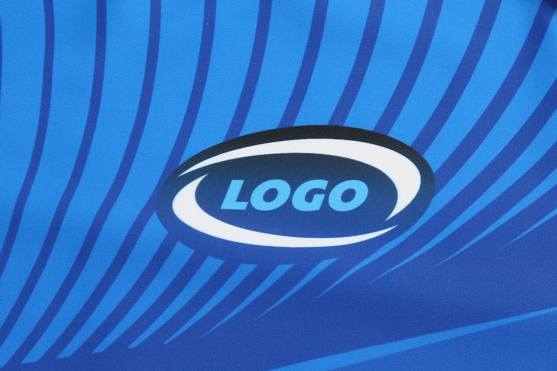 A blue fabric with dynamic stripes featuring a logo in the centre.