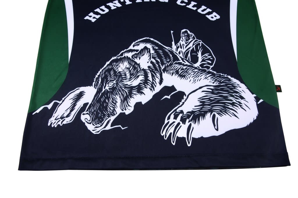 A black and green polo shirt featuring a graphic of a bear and a hunter. It has a logo on one side.