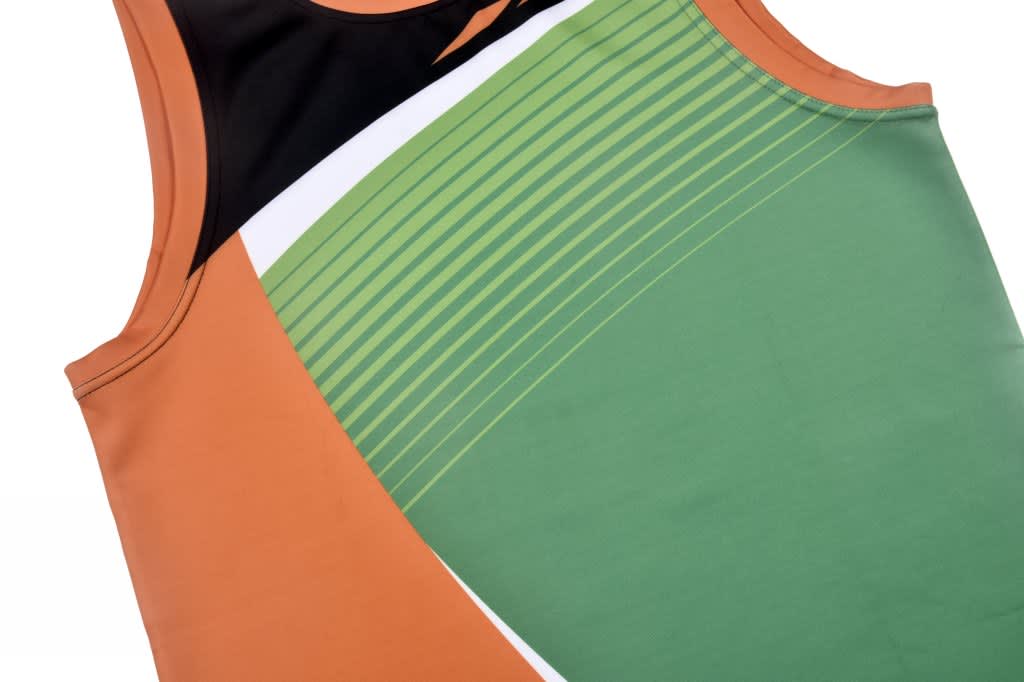 A tank top featuring an orange, green, and black design with diagonal lines and a logo.