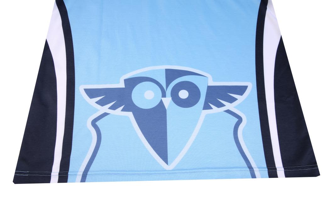 A blue sublimated cotton shirt featuring a graphic design with an owl motif and contrasting black and white stripes.