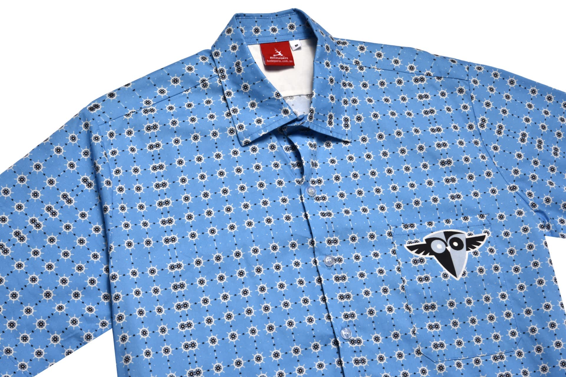 A checked shirt in blue featuring a floral pattern and a logo on the front.