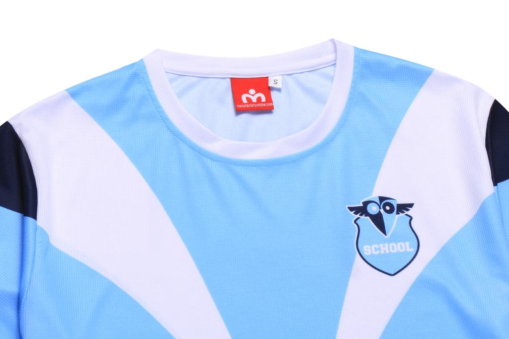A light blue and white mini waffle tee featuring a logo, with dark blue accents on the sleeves.