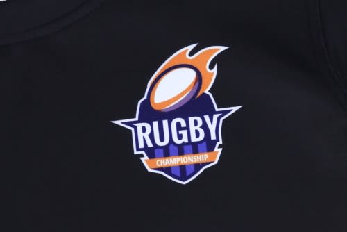 A black rugby top featuring a colourful logo, designed for sports uniforms.