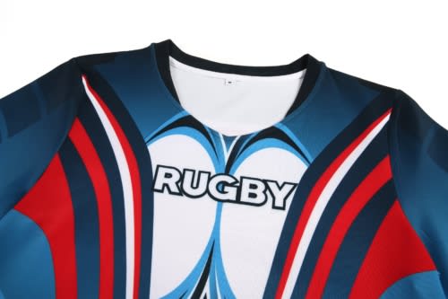 A sports jersey featuring blue, red, and white colours, with a logo on the front and a rounded neckline.