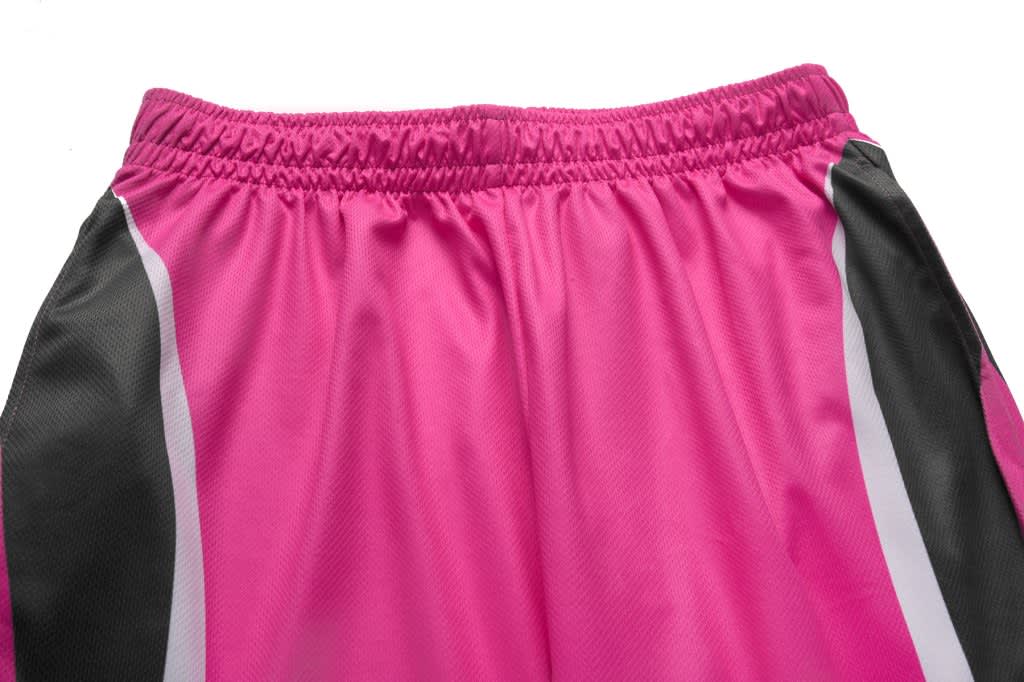 A pair of pink athletic pants with black and white side panels, featuring an elastic waistband.
