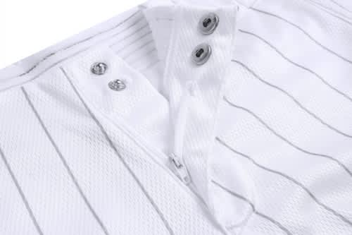 A white baseball uniform featuring a zippered neck and subtle pinstripes, with buttons and a logo.