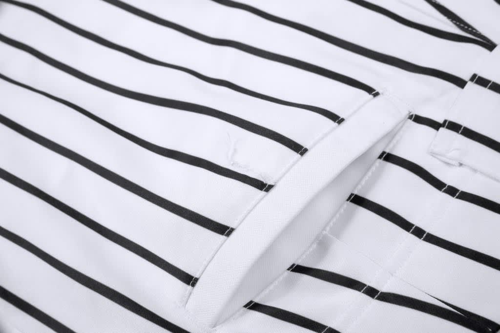A white baseball/softball pant featuring black stripes and a visible pocket detail. Includes a logo.