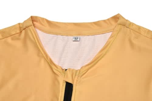 A yellow sports jersey featuring a zip front and mesh lining, with a size label inside.