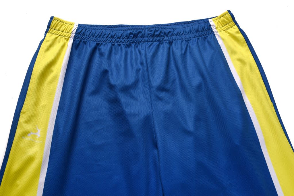 Blue indoor pants with yellow and white side stripes and an elastic waistband. The pants feature a logo.