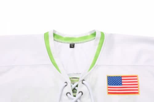 A white ice hockey racing suit with a green collar and laces, featuring an American flag patch.