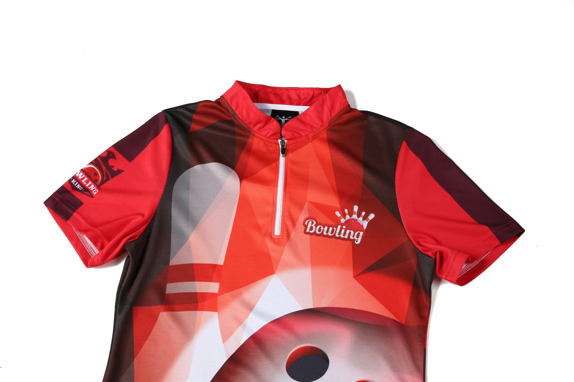 A red bowling team shirt featuring a collar and a zip, with a design incorporating bowling imagery and a logo.